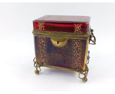 A Moser late 19thC ruby glass casket, with brass overlay, enamel decorated with floral motifs and foliate scrolls, and gilt d
