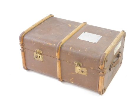 A canvas and wooden bound trunk, with railway labels and named for a pupil at the Old House School, Bembridge, Isle of Wight,