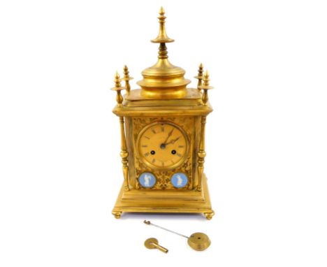 A Howell James &amp; Company brass cased mantel clock, circular dial with engine turned decoration, chapter ring bearing Roma