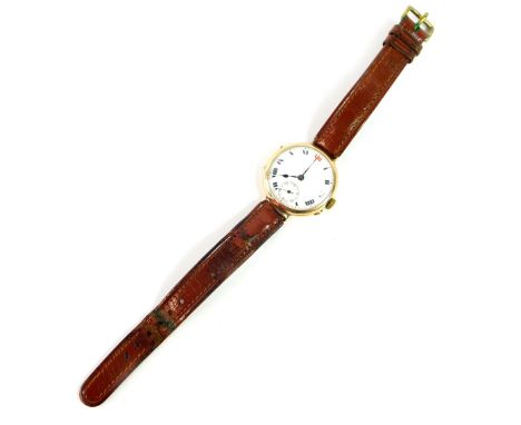 A 9ct gold wristwatch, circa 1915, circular cased, white enamel dial bearing Roman numerals, subsidiary seconds dial, on a le