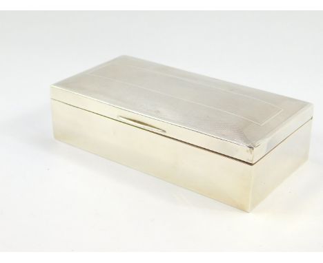 A George VI silver twin division cigarette box, with engine turned decoration, Birmingham 1946, 18cm wide, 8.5cm deep., 15.20