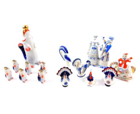 A Russian porcelain liqueur set, of standing fish form, comprising a decanter and stopper and six tots, together with three f