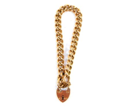 A 9ct gold curb link bracelet, on a heart shaped padlock clasp, with safety chain as fitted, 31.3g.