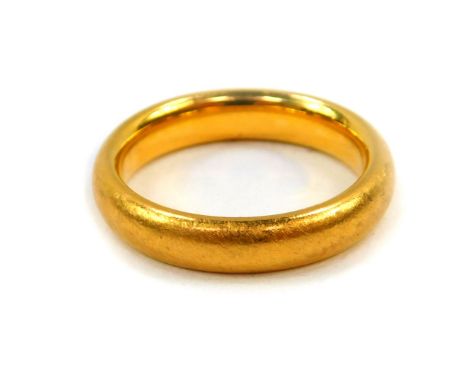 A 22ct gold wedding band, size K, 6.8g.