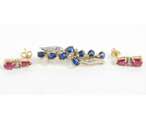 A sapphire and diamond floral spray brooch, set in yellow metal, stamped 9ct, 2.3g., together with a pair of ruby and diamond