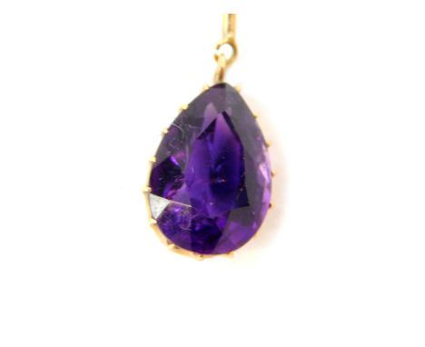 A pear shaped amethyst pendant, set in yellow metal, on an oval link neck chain, with bolt ring clasp, marked 9ct, 8.5g.