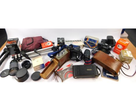 A Eumig Cine camera, model C3., Kodak camera, Zenit 11 camera, tripods, accessories and books. (a quantity)