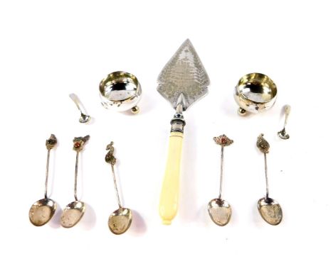 A pair of silver plated circular salts, raised on ball feet, with spoons, five Far Eastern gem set coffee spoons, with variou