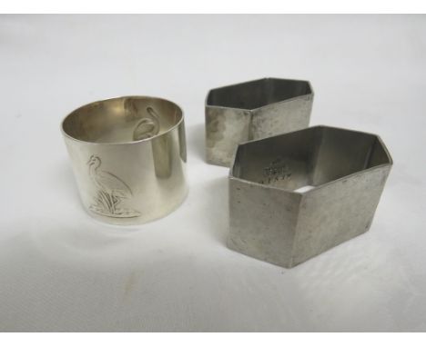 A PAIR OF LIBERTY &amp; CO TUDRIC PEWTER HEXAGONAL NAPKIN RINGS, FULL MARKED, PATTERN NUMBER 0157; AND A WMF SILVER-PLATED NA