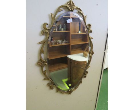 OVAL BEVELED EDGED WALL MIRROR WITH GILT EFFECT SURROUND