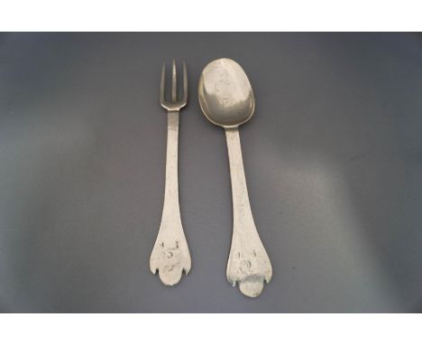 A pewter triffid fork and spoon, stamped Jamaica and with initials
