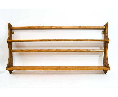 An Ercol 'Golden Dawn' plate rack, 48cm high x 96cm wide