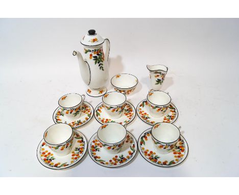 A Royal Doulton tea service of small proportions, decorated with a citrus fruit pattern, comprising: coffee pot, milk jug, su