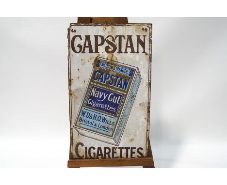 An enamel Will's Woodbine Cigarettes sign, 91cm x 62cm and a Capstan Cigarettes enamel sign, 79cm x 46cm