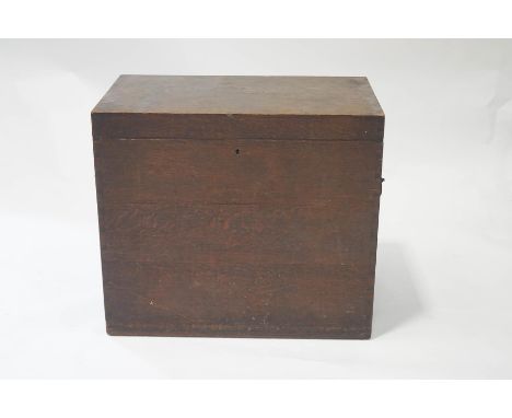 An Army and Navy oak chest with iron carrying handles, containing three compartmental lift out trays for tableware, 74cm high