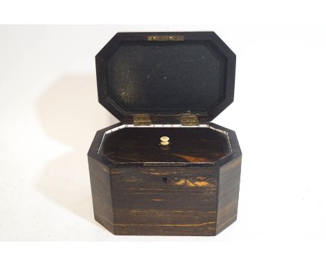 A George III coromandel tea caddy of octagonal shape, with interior lid, 15.5cm wide