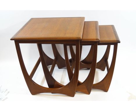 A nest of three Ercol style teak tables, the largest 51cm high x 50cm square