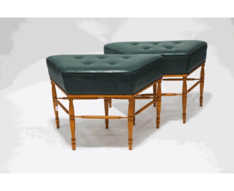 A pair of window seats with leather button seats on turned legs linked by stretchers, 68cm high x 97cm wide x 45cm deep