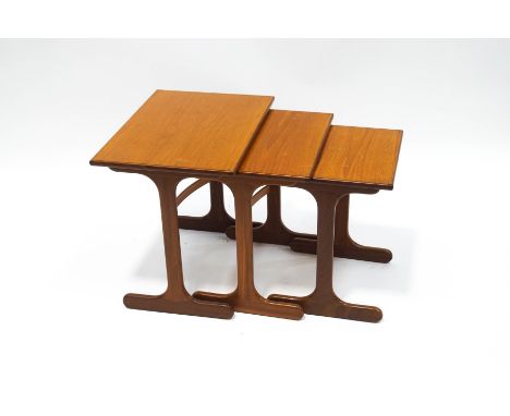 A nest of three Ercol style teak tables, the largest 51.5cm high x 56cm wide x 41cm deep