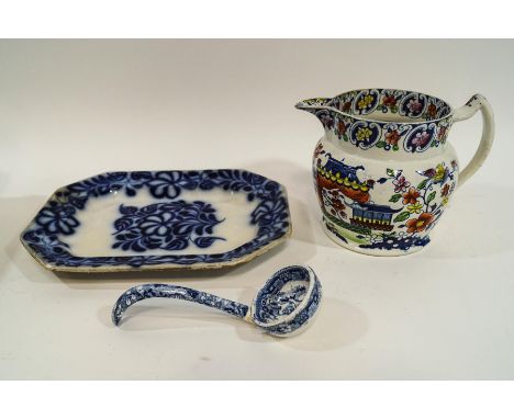 An early 19th century earthenware jug, transfer printed and painted Chinoiserie decoration, 14cm high, a small serving dish a