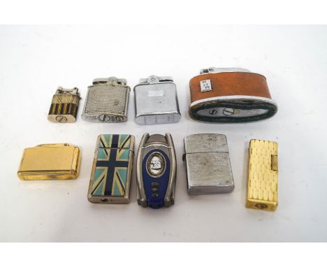 A collection of nine lighters, including a Ronson leather mounted table lighter and a Colibri engine turned gilt metal exampl