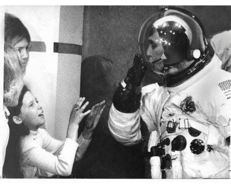 
	
		The last man to walk on the Moon, Gene Cernan, blows a farewell kiss to his daughter Tracey as he makes his way to the s