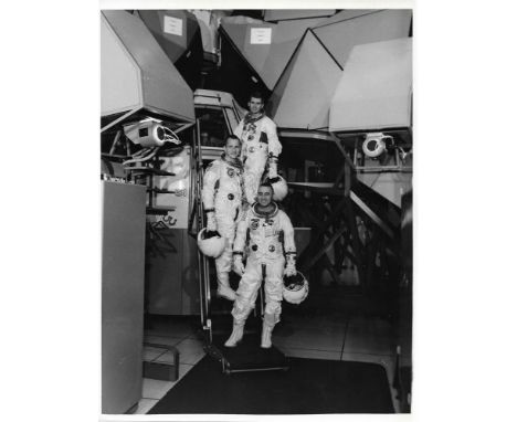 
	
		Portrait of the first and ill-fated crew of the Apollo program, Virgil Grissom, Edward White and Roger Chaffee, leaving 