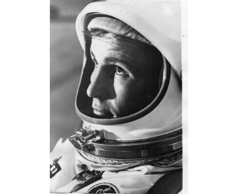 
	
		Pre-flight portrait of Ed White depicting the astronaut suited up in preparation for the flight the following day and th