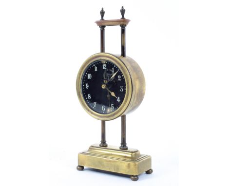 A late 19th/early 20th century pillar gravity mantel clock, weight driven movement, with visible escapement, the glass dial w