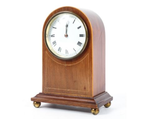 A dome topped Edwardian style string inlaid mahogany mantel clock. H:21cm.