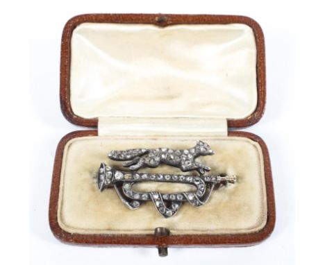 A yellow and white metal brooch stylized as a fox and trombone measuring 40.0mm length, set with rose cut diamonds estimated 