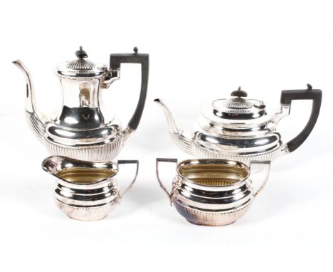 An Edwardian four piece EPNS tea service, in the Georgian style, of reeded form, 20.5 cm high, comprising: a baluster coffee 