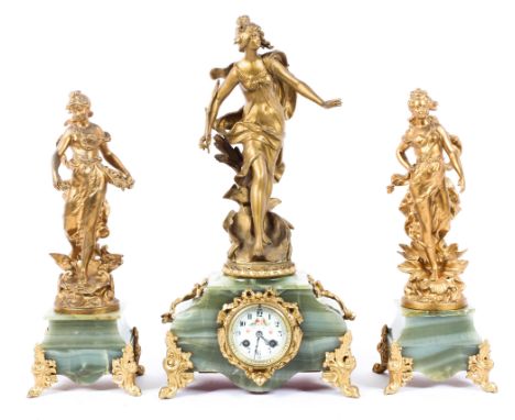 A French gilt metal and onyx mouted figural three piece clock garniture, late 19th century, the clock surmounted by a maiden 