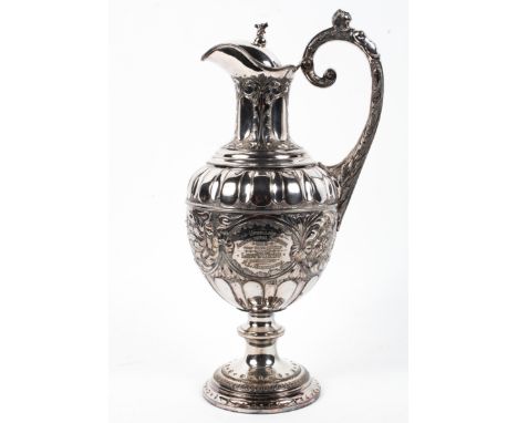 A Victorian silver plated prize ewer and hinged cover, oviform with herm handle, cast with gadroons and embossed with scrolli