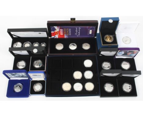 Silver coins - Proof £5 coins and a 2009 Britannia four coin set; together with silver and enamel collectors coins. 