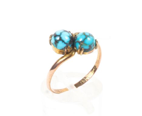 A 9ct rose gold crossover ring set with two turquoise cabochons. 1.5g. Size O. 