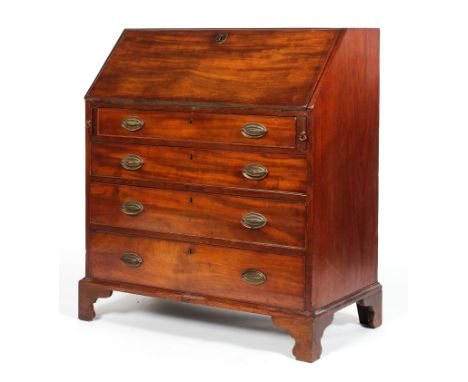 A George III mahogany bureau, the fall front lined with green baize, revealing a fitted interior with pigeon holes, four draw