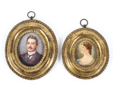 Two Victorian portrait miniatures of a lady and gentleman, each bust-length, probably on ivory, in beeded giltwood frames, th