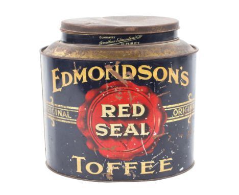 A large vintage shop display toffee tin for 'Edmondson's Red Seal', of oval form with a removeable lid, height 29cm