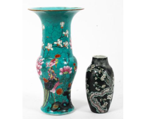 A Canton turquoise baluster beaker vase together with a Chinese black ground small oviform vase, the first painted in the fam