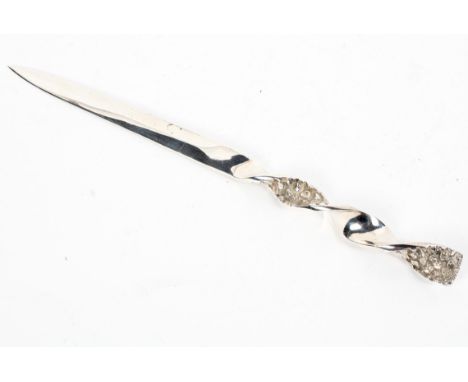 Stuart Devlin, a sterling silver letter opener the sharp dagger blade with twist and openwork textured handle by Stuart Devli
