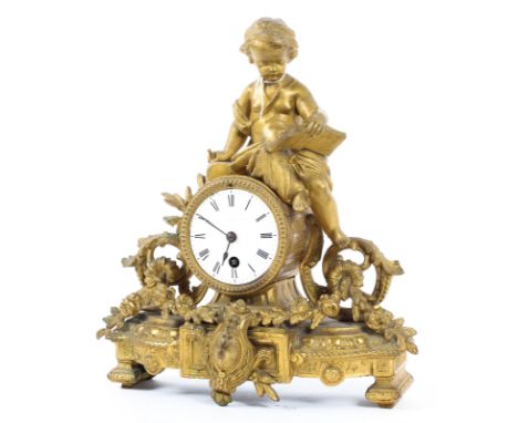 A French gilt metal mantel clock, late 19th century, the case stamped 11 F.H. Mourey 74, surmounted by a putto reading seated