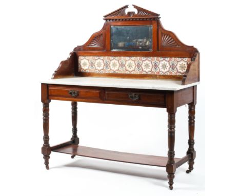 A Victorian walnut marble topped washstand, with architectural mirrored pediment above tiled gallery and white marble top, wi