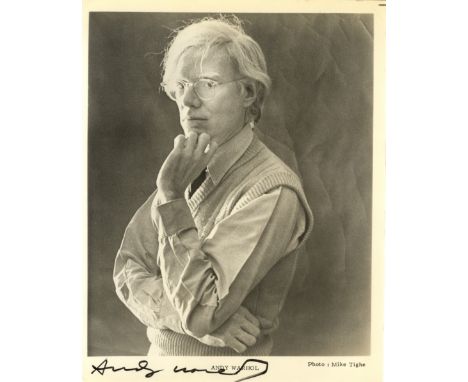 WARHOL ANDY: (1928-1987) American Pop Artist. Signed 8 x 10 photograph of Warhol standing in a pensive half length pose with 