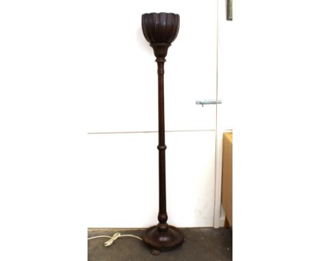 An unusual oak standard lamp / up lighter, in the form of a raised jardini&egrave;re on turned column and circular base
