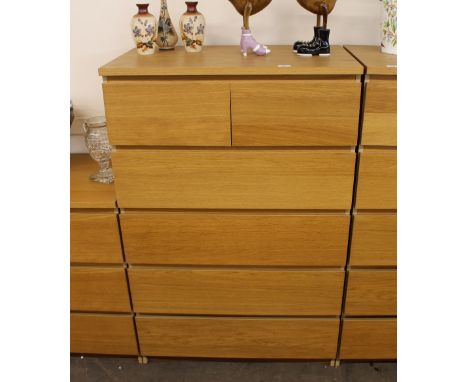 A modern light wood chest, of two short and four long drawers, 80cm wide