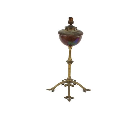 A brass and copper oil lamp, in the manner of W.A.S. Benson, raised on stylist foliate triform base, later converted to elect