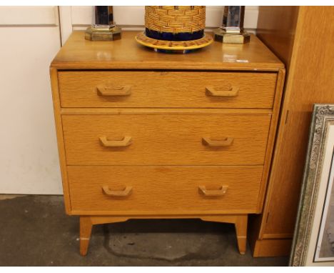 A G-plan light oak chest, of three drawers raised on square tapering supports, 75.5cm