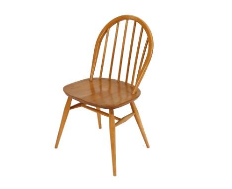 A set of four Ercol stick back dining chairs 