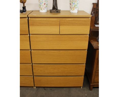 A modern light wood chest, of two short and four long drawers, 80cm wide